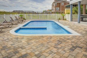 An picture of a blue inground backyard pool