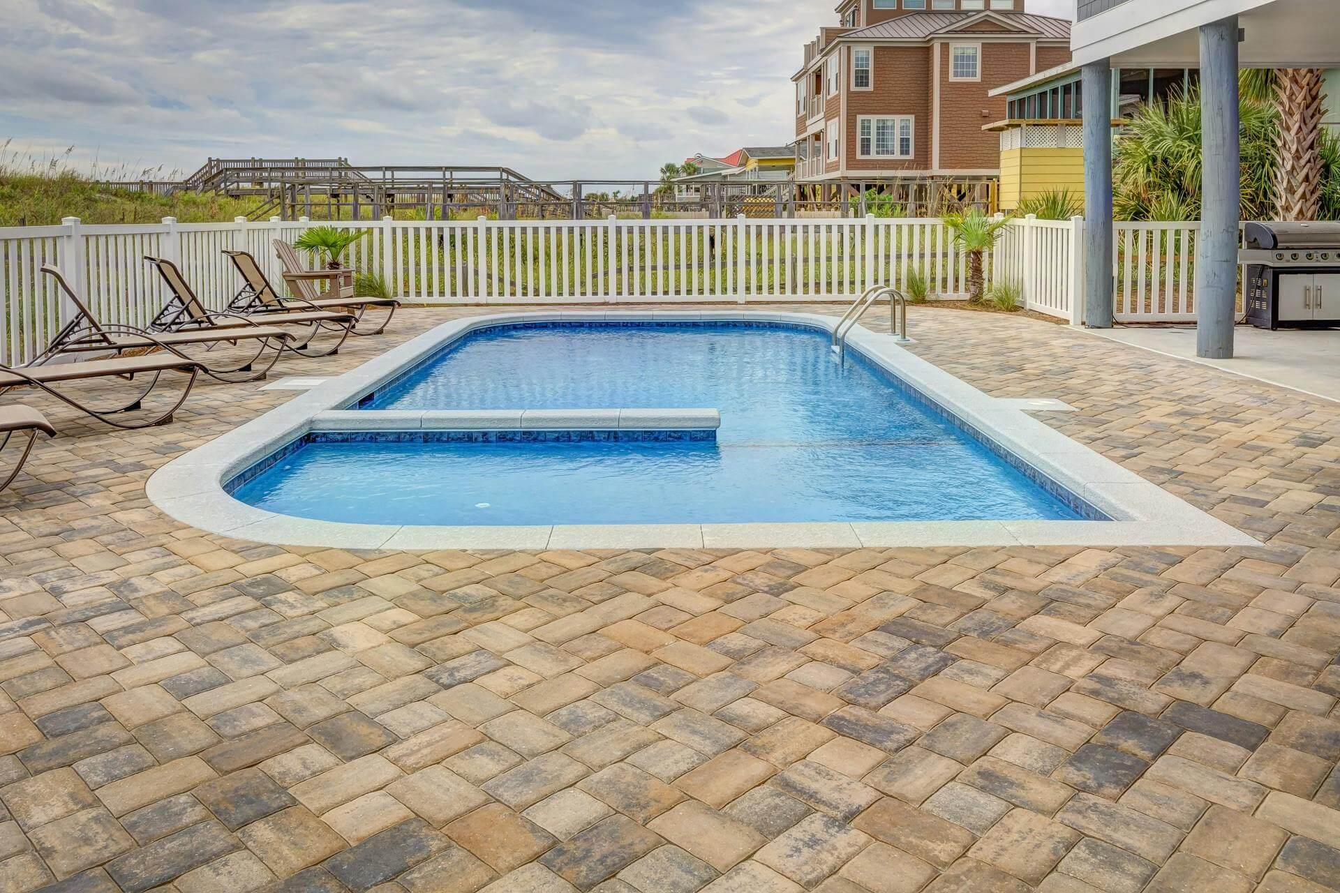 An picture of a blue inground backyard pool